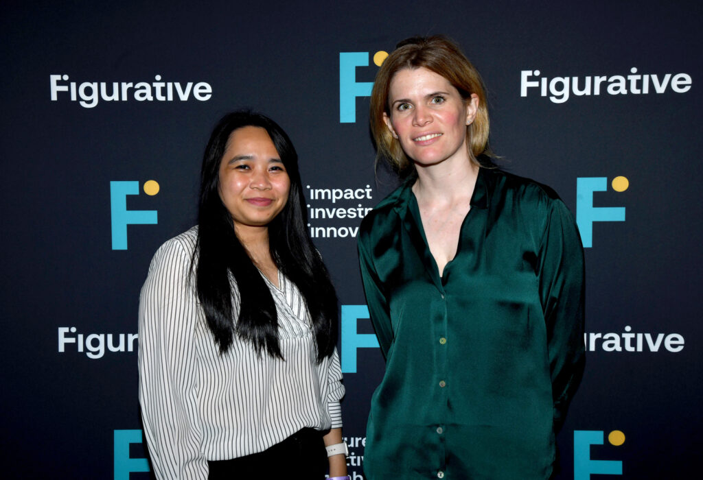 two women pose for a photo