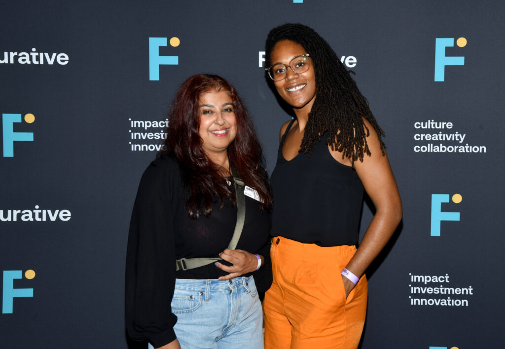 two women pose for a photo